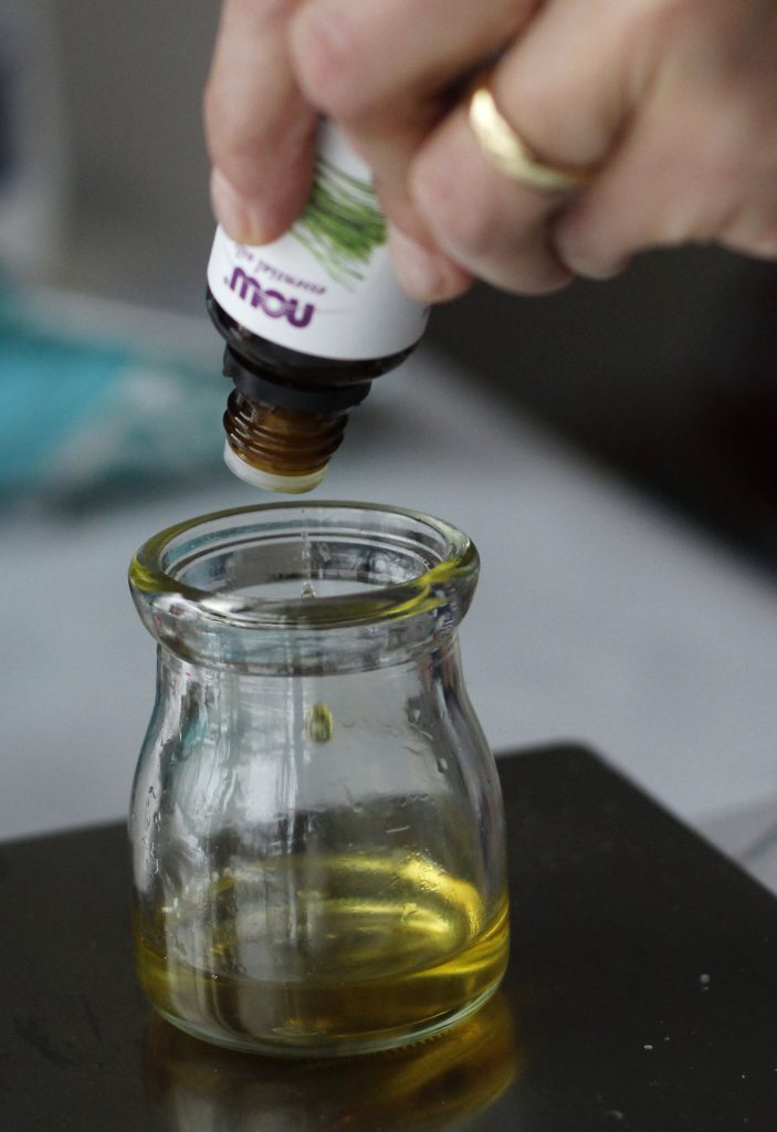 Measuring out the essential oil- make sure you're using a glass container