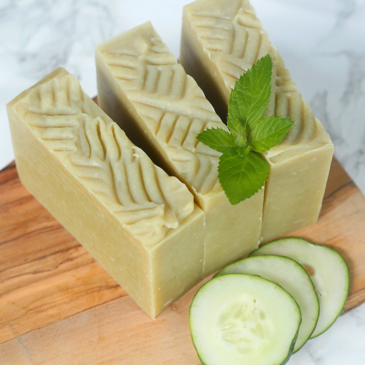soap with cucumber slices and mint leaf.