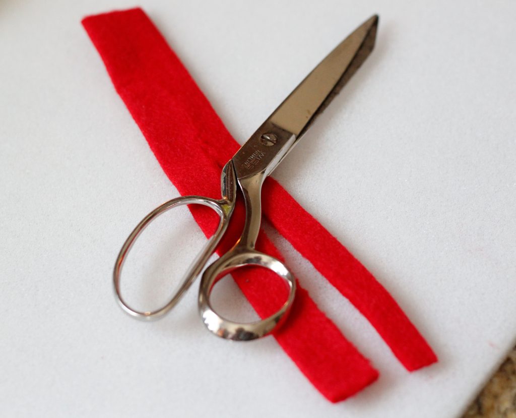 Cutting piece of felt ribbon