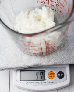 shea butter in measuring bowl