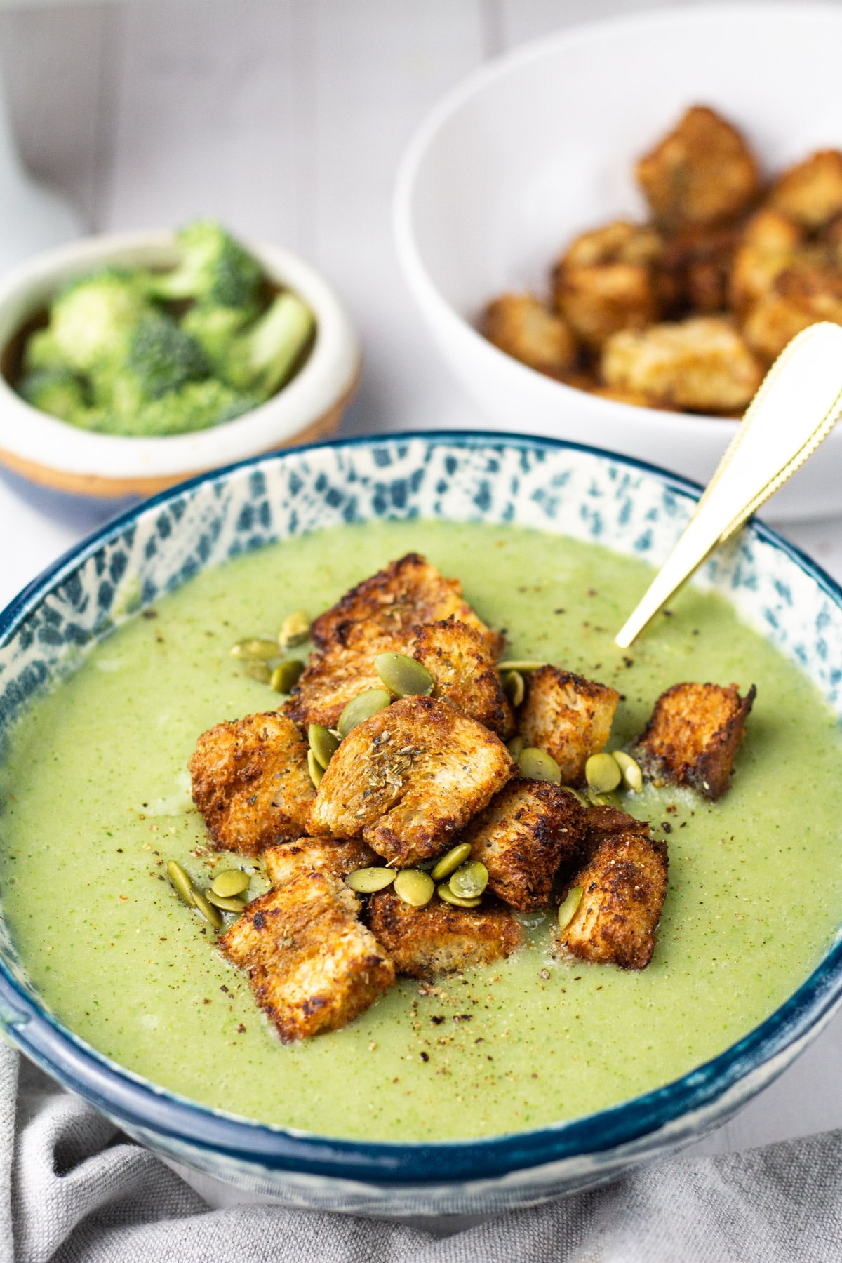 cream of broccoli soup in bowl with croutons