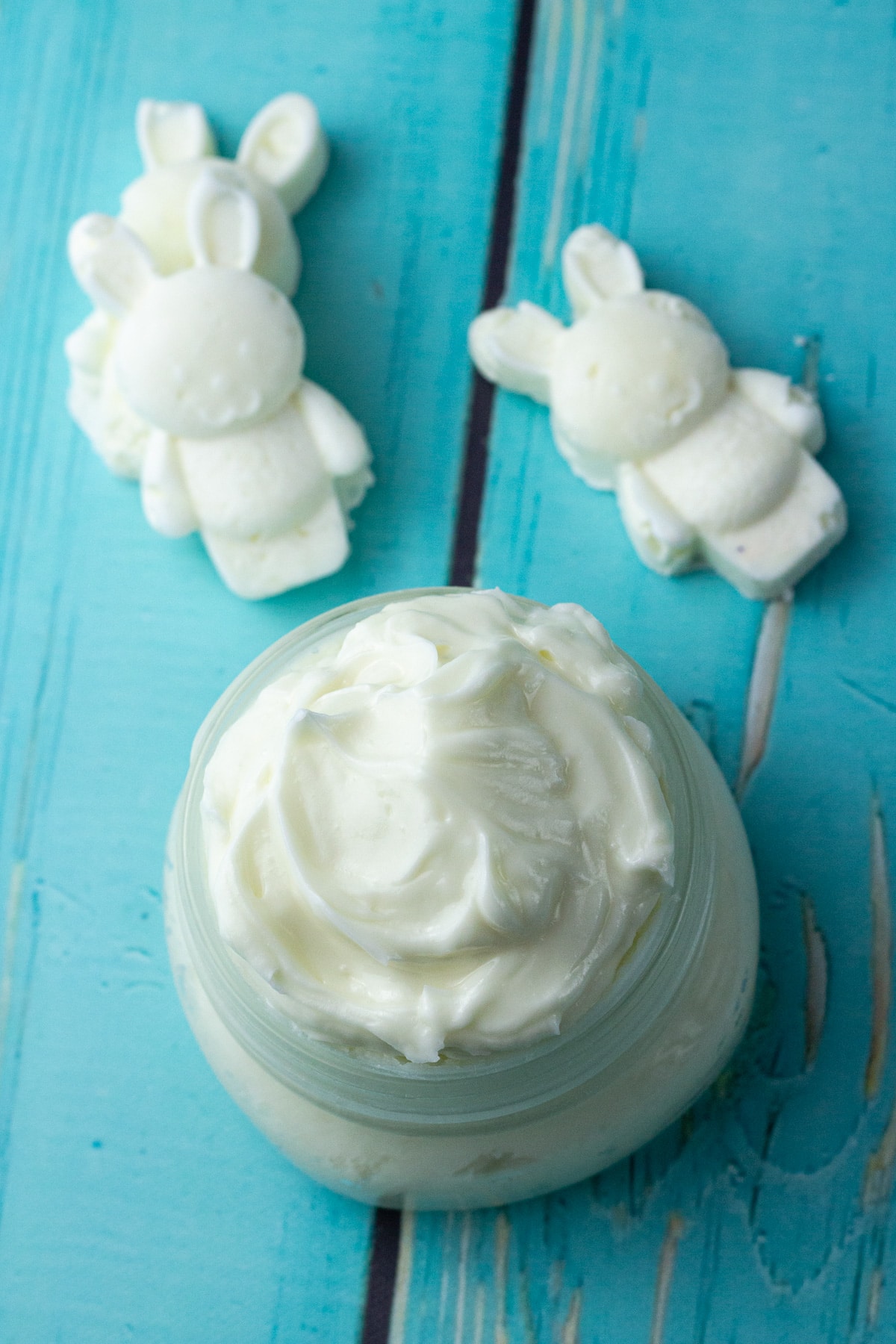 breastmilk lotion in jar and lotion bars in bunny shape.
