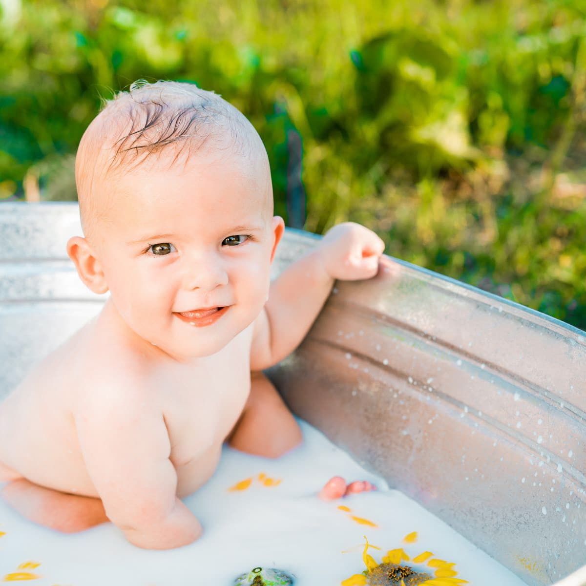 boy in bath tub with milk bath.