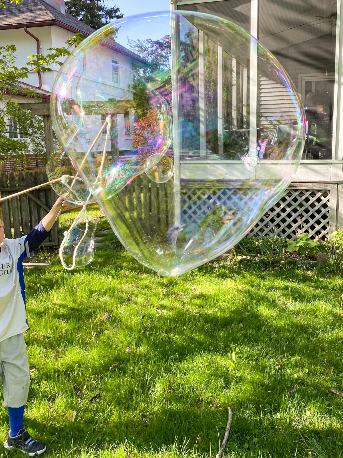 giant soap bubbles floating through air.