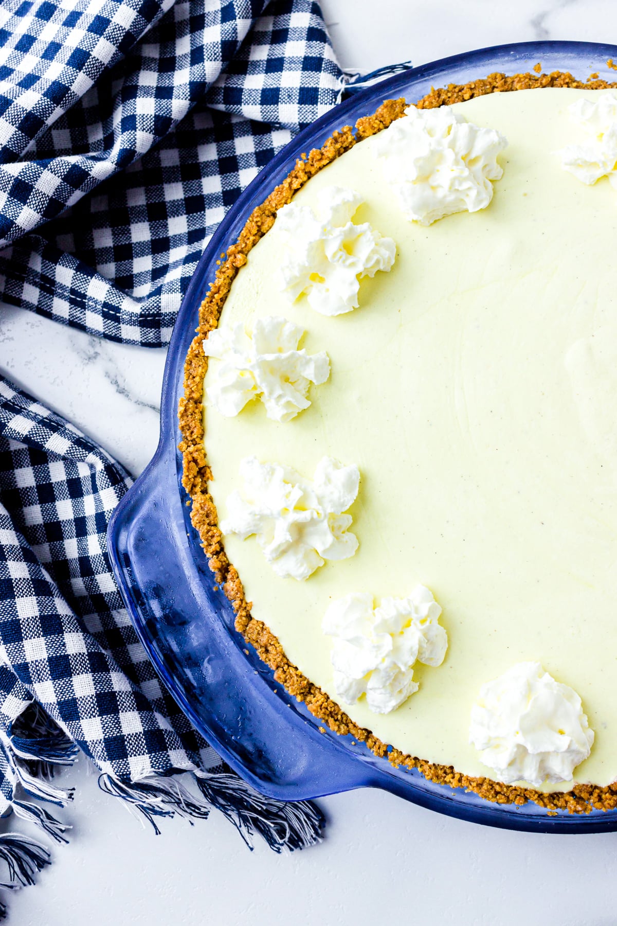 frozen lemonade pie with whipped cream on top.